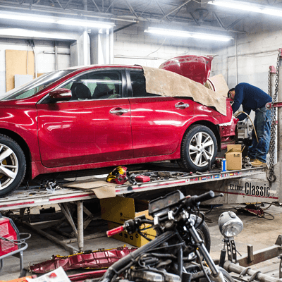 NewEnglandCollision_On-theLift Auto Body And Collision Repair Shop